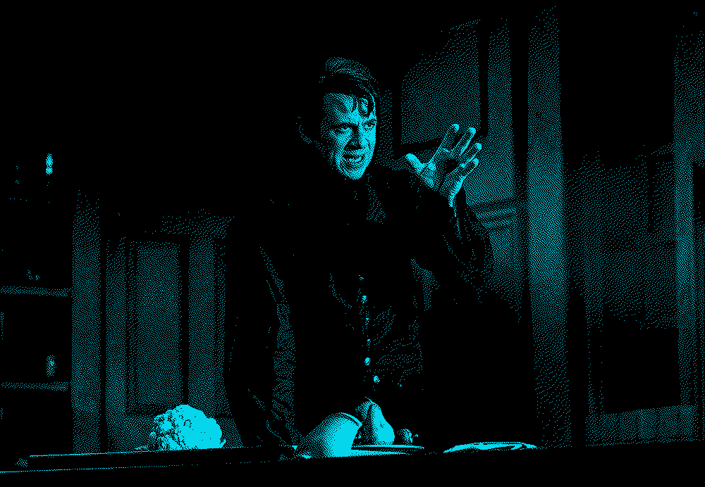 Nick Westrate's Victor Frankenstein gestures angrily over a bowl of fruit